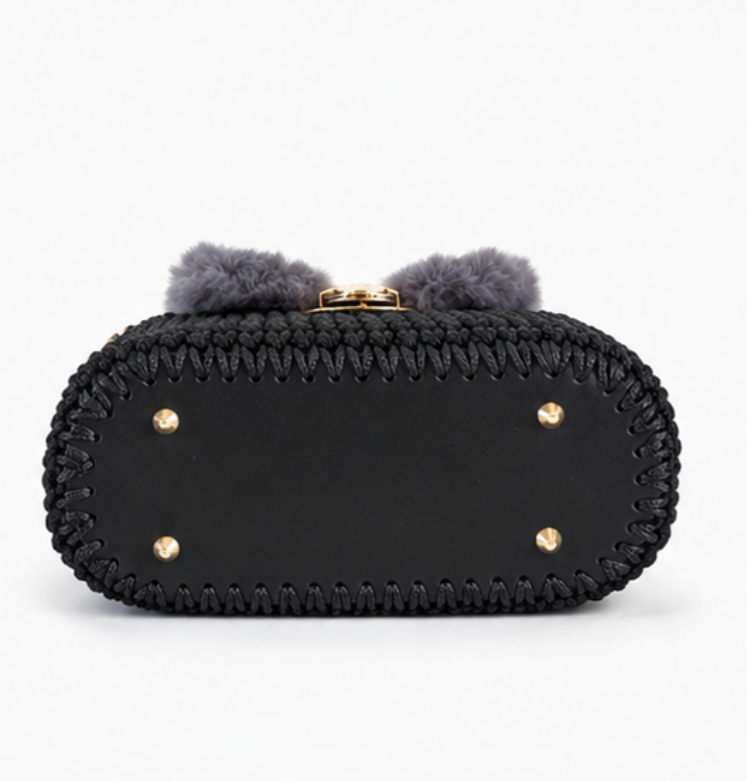 Handmade crochet handbag with top handles, adjustable gold chain strap, turn-lock closure, and gold-tone hardware.